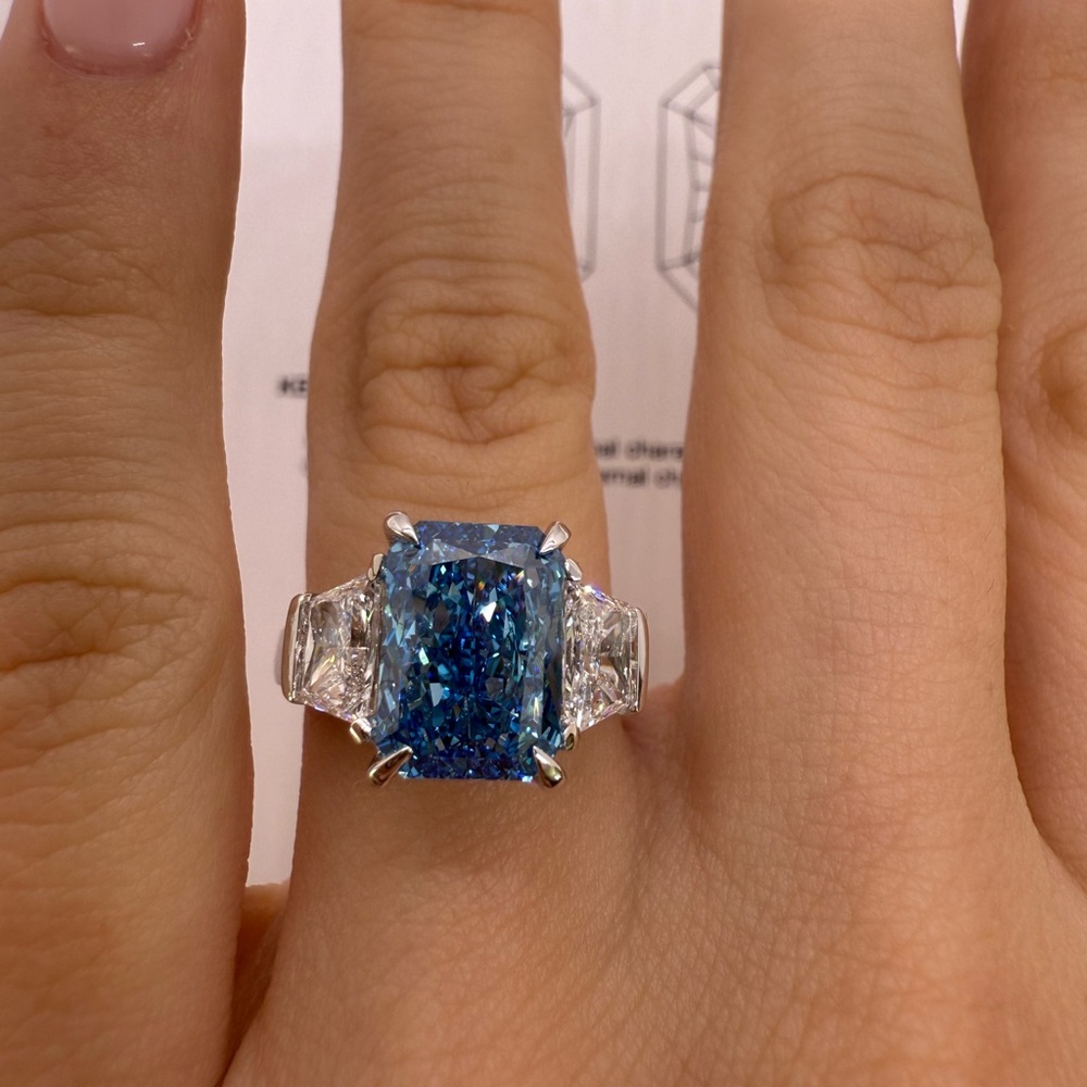 4.09 carat fancy vivid blue radiant lab grown diamond trapezoid engagement ring